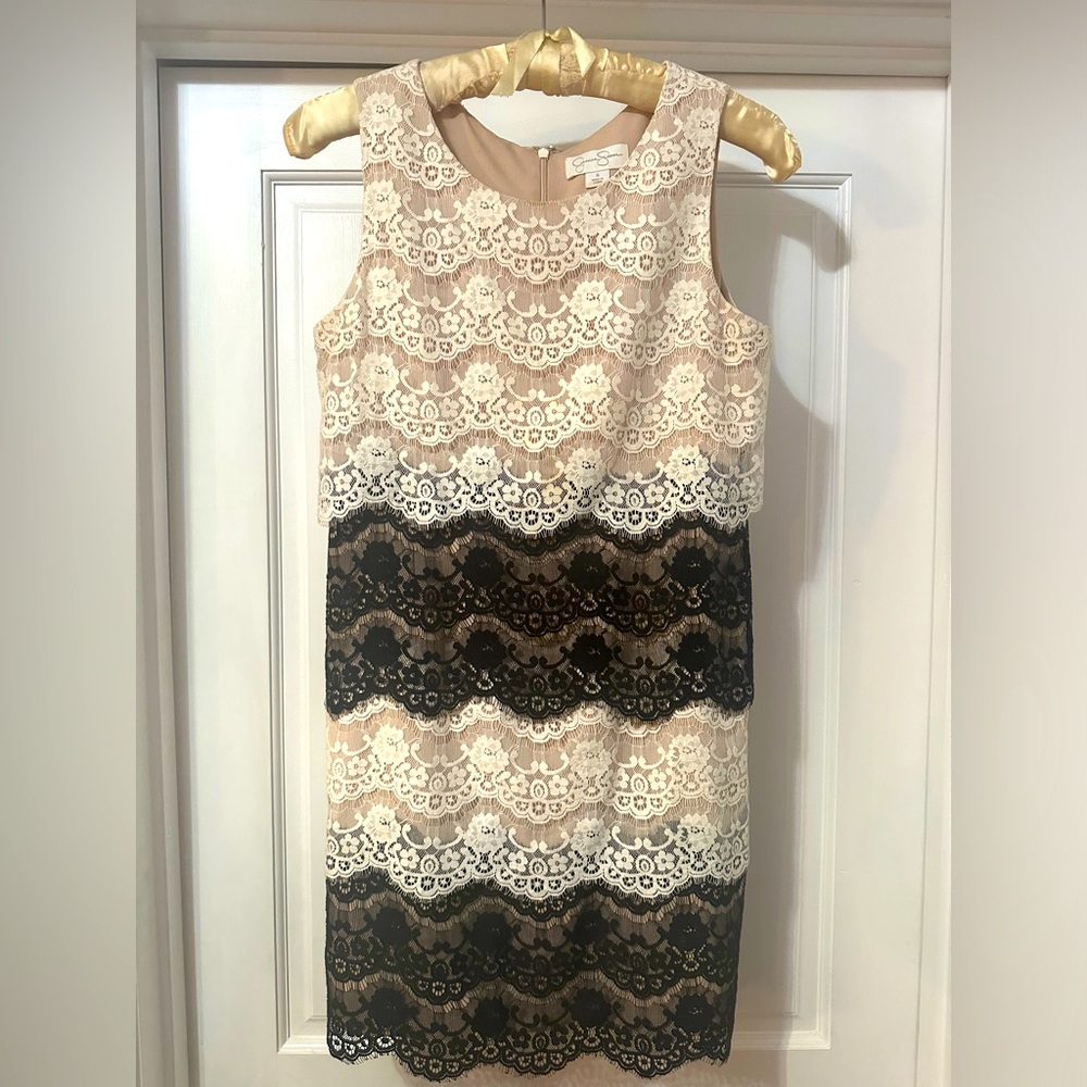 Black and white cocktail dress, with tan lining.
